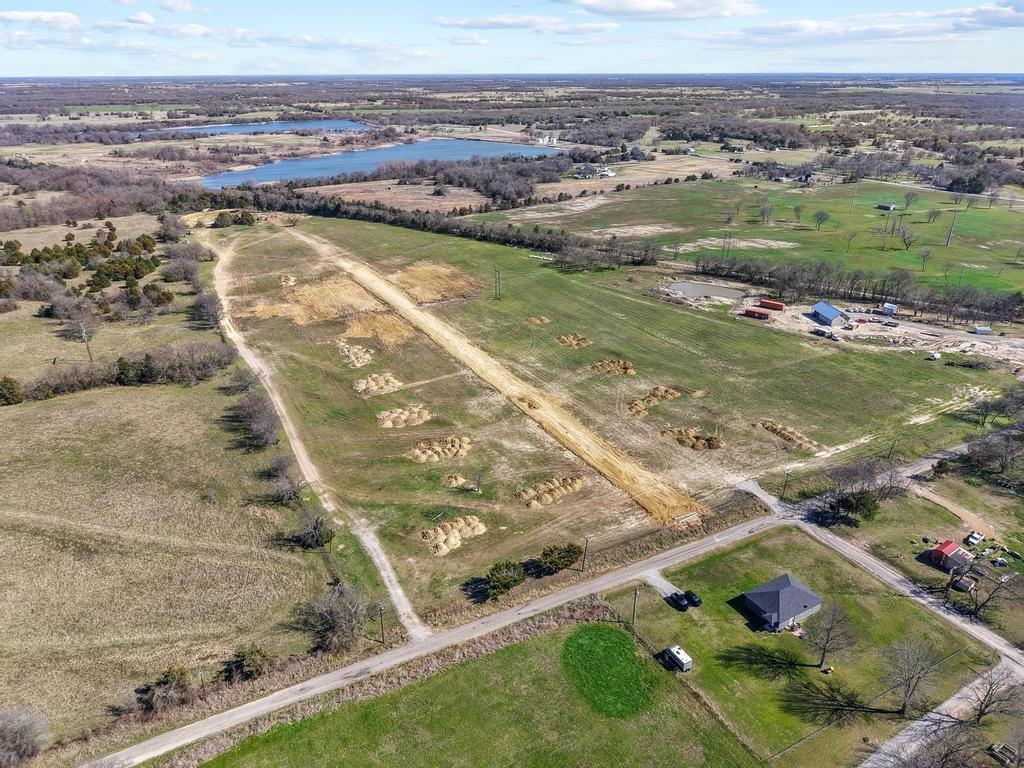 327 Roundtree Circle Wolfe City, TX 75496 - Photo 8 of 11 an aerial view of residential houses with outdoor space