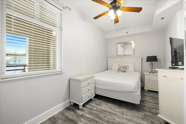 a room with a bed and a chandelier