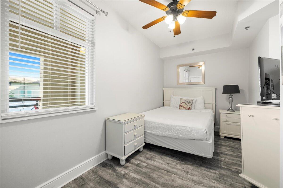 1150 Santa Rosa Boulevard, Unit 520 Fort Walton Beach, FL 32548 - Photo 13 of 25 a room with a bed and a chandelier