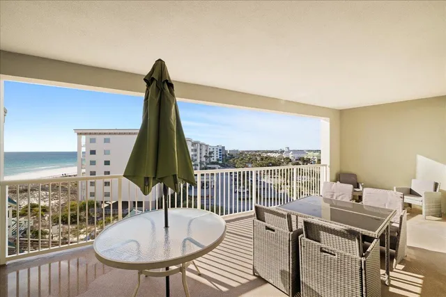 a view of a dining room with furniture window and outside view