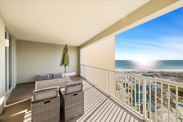 a view of a balcony with furniture