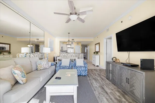 a living room with furniture and a flat screen tv