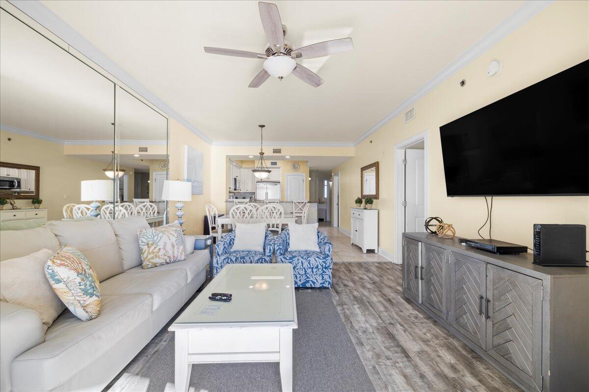 1150 Santa Rosa Boulevard, Unit 520 Fort Walton Beach, FL 32548 - Photo 8 of 25 a living room with furniture and a flat screen tv