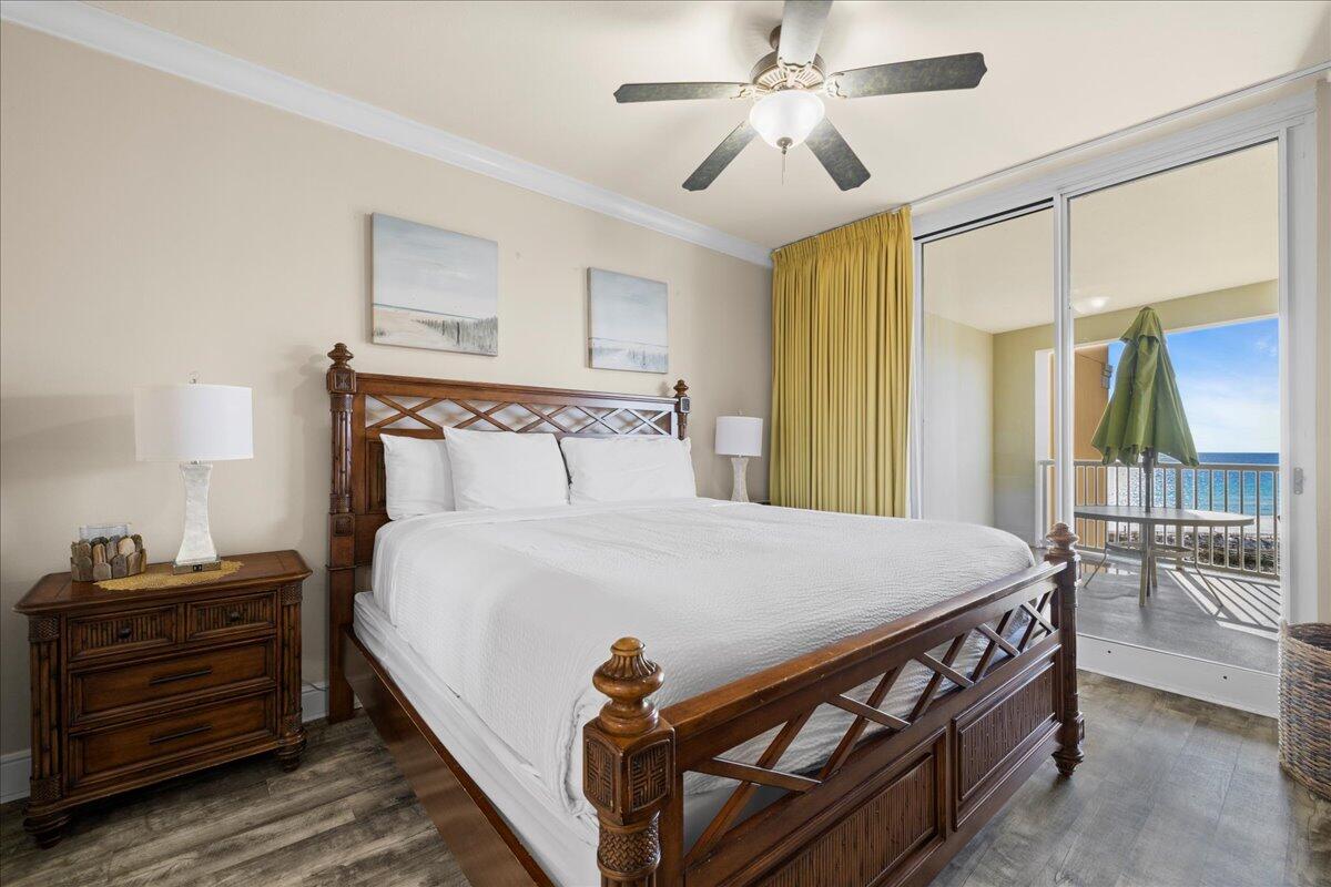 1150 Santa Rosa Boulevard, Unit 520 Fort Walton Beach, FL 32548 - Photo 9 of 25 a bedroom with a bed and a chandelier
