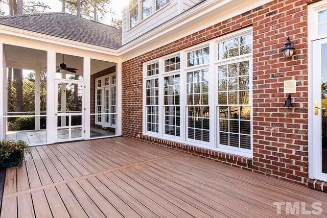 a view of a balcony with wooden floor