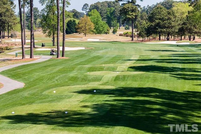 a view of a golf course with a lake