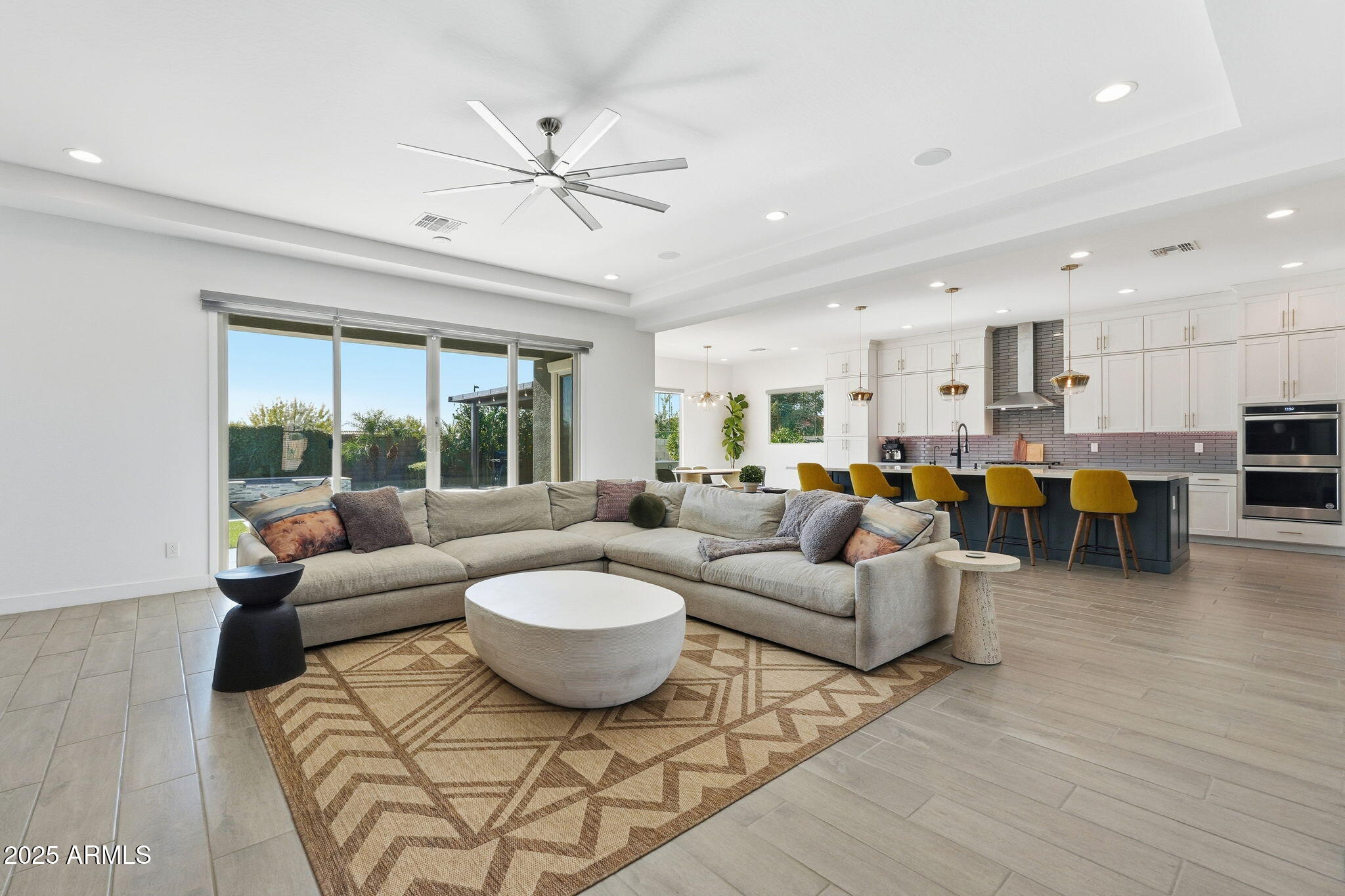 22679 East Russet Road Queen Creek, AZ 85142 - Photo 13 of 51 a living room with furniture kitchen view and a large window