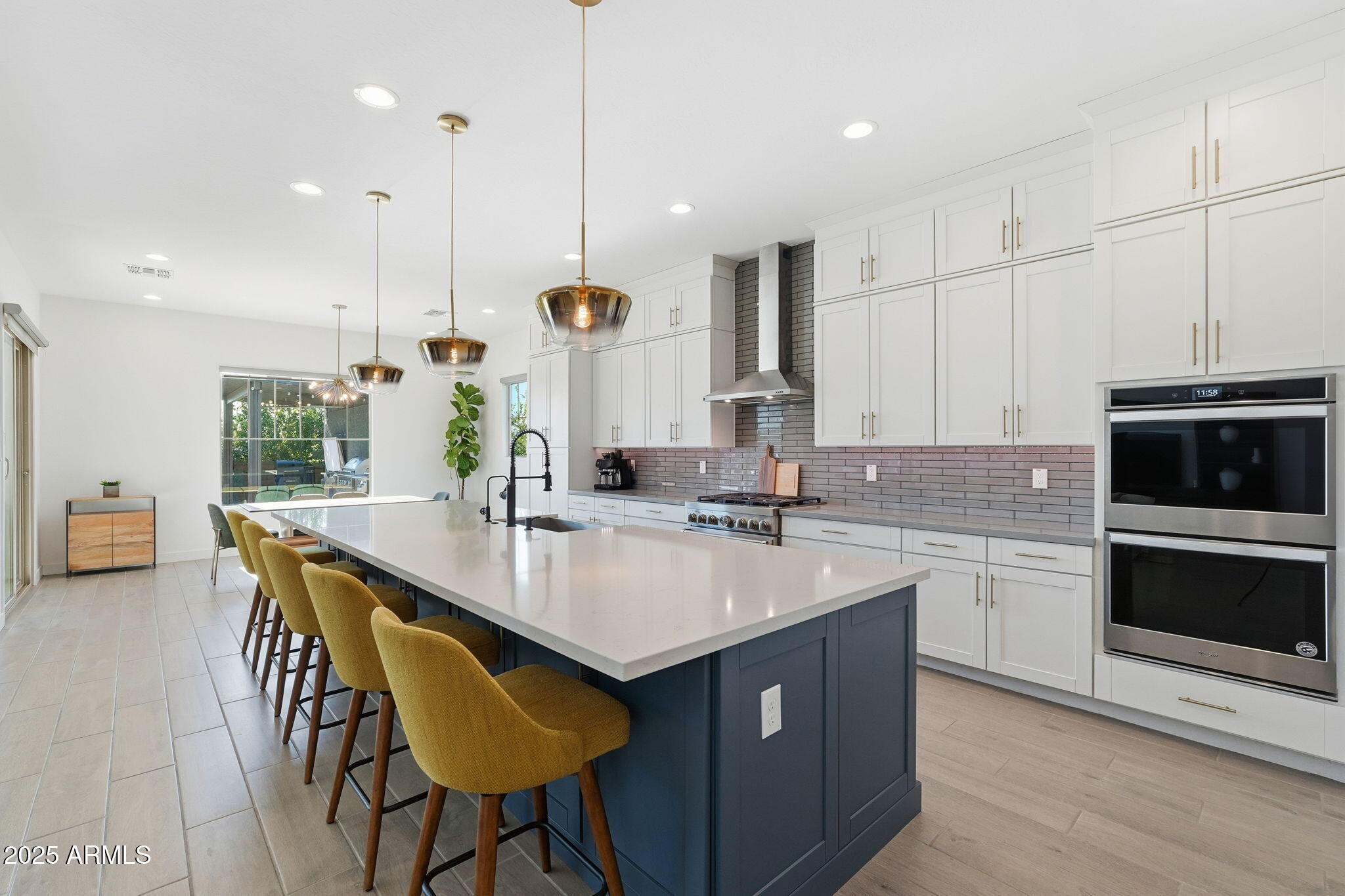 22679 East Russet Road Queen Creek, AZ 85142 - Photo 18 of 51 a kitchen with a sink a microwave a stove and chairs