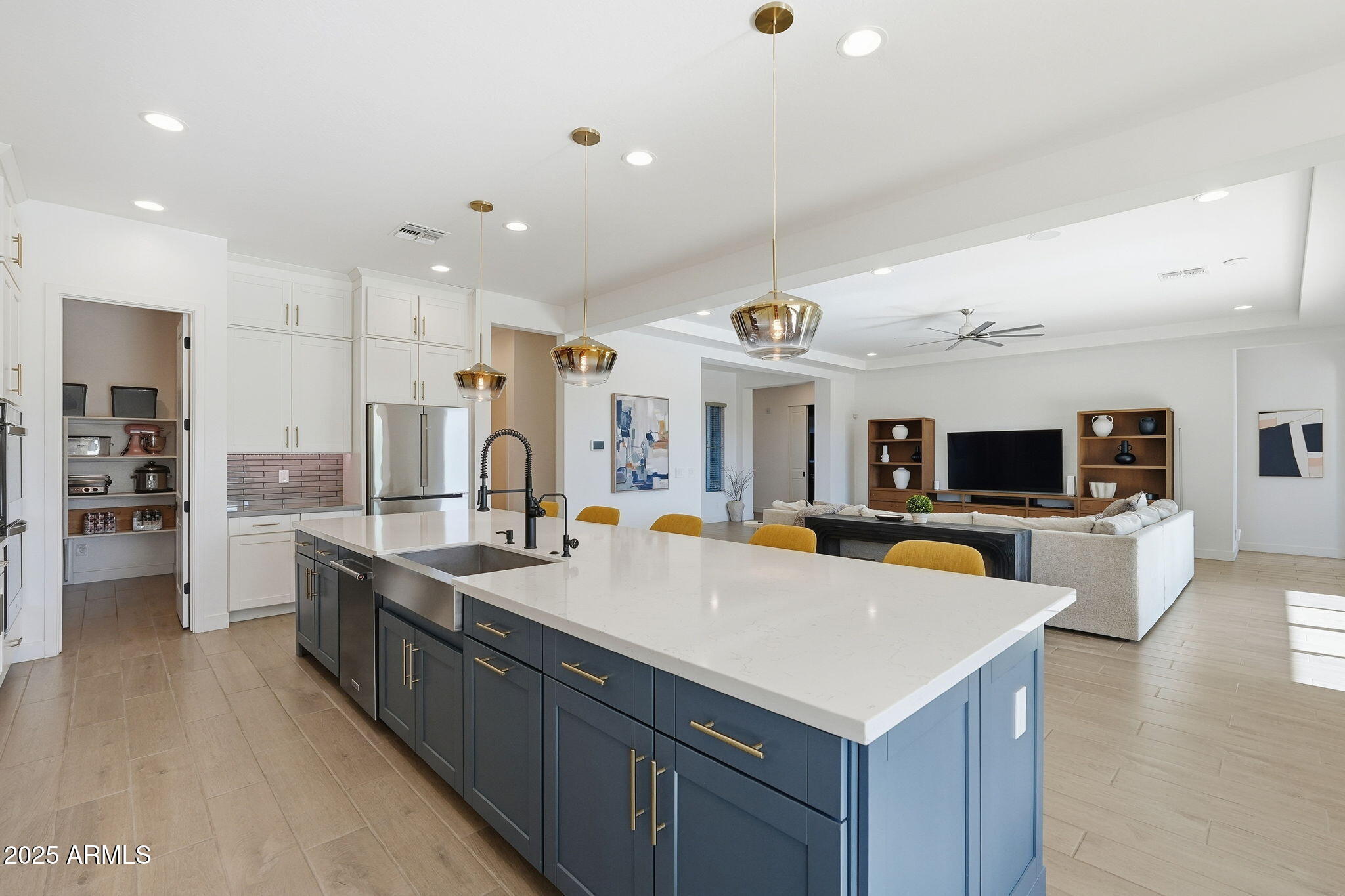 22679 East Russet Road Queen Creek, AZ 85142 - Photo 19 of 51 a large kitchen with a large counter top appliances and cabinets