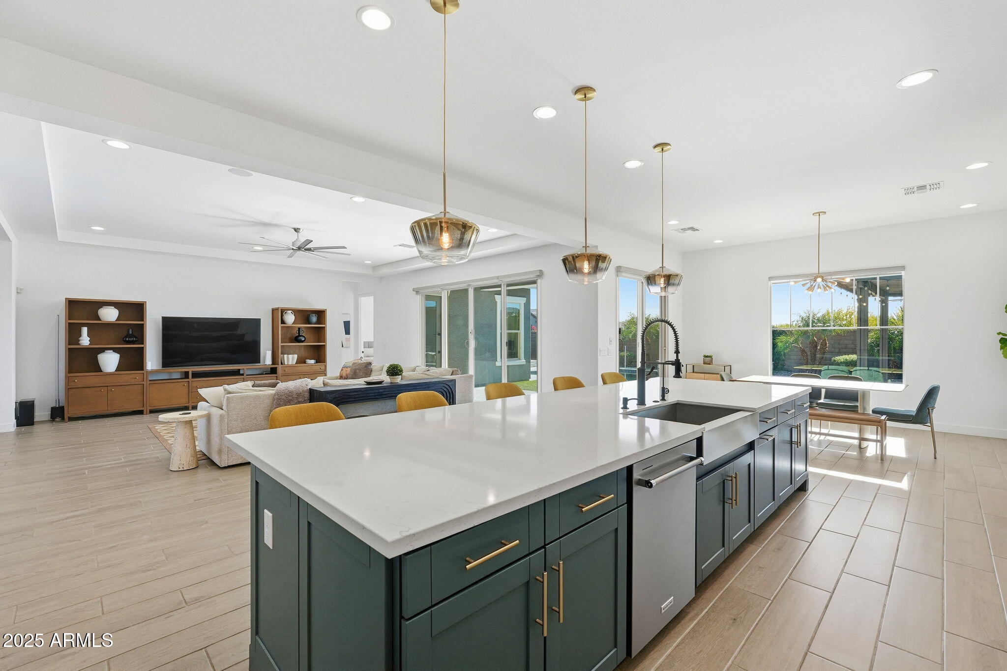 22679 East Russet Road Queen Creek, AZ 85142 - Photo 21 of 51 a kitchen with counter top space a sink appliances and living room view
