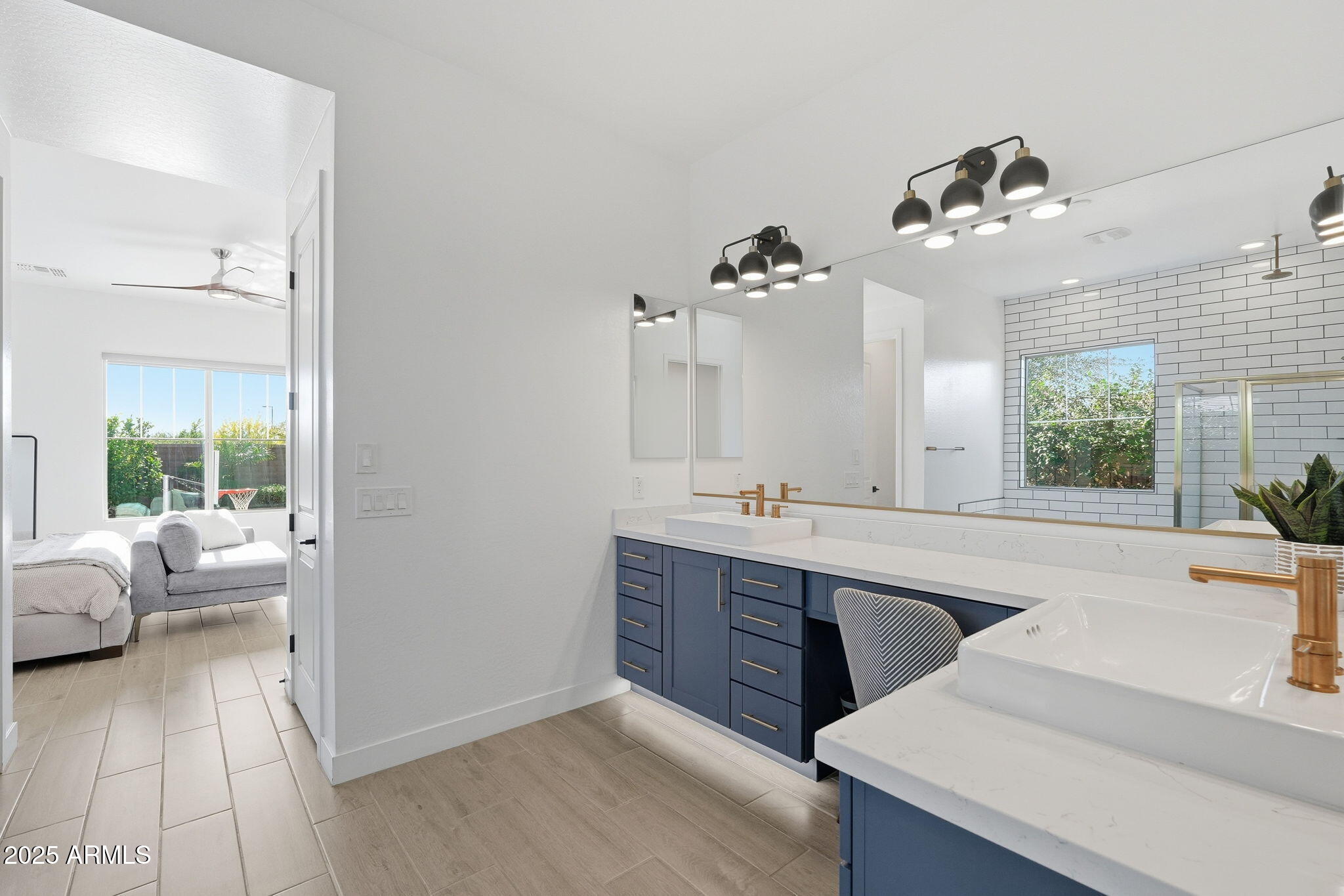 22679 East Russet Road Queen Creek, AZ 85142 - Photo 29 of 51 a spacious bathroom with a sink double vanity and a large mirror