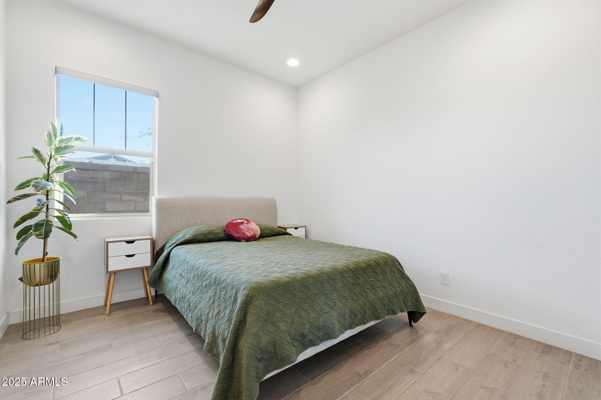 22679 East Russet Road Queen Creek, AZ 85142 - Photo 32 of 51 a bedroom with a bed and a potted plant