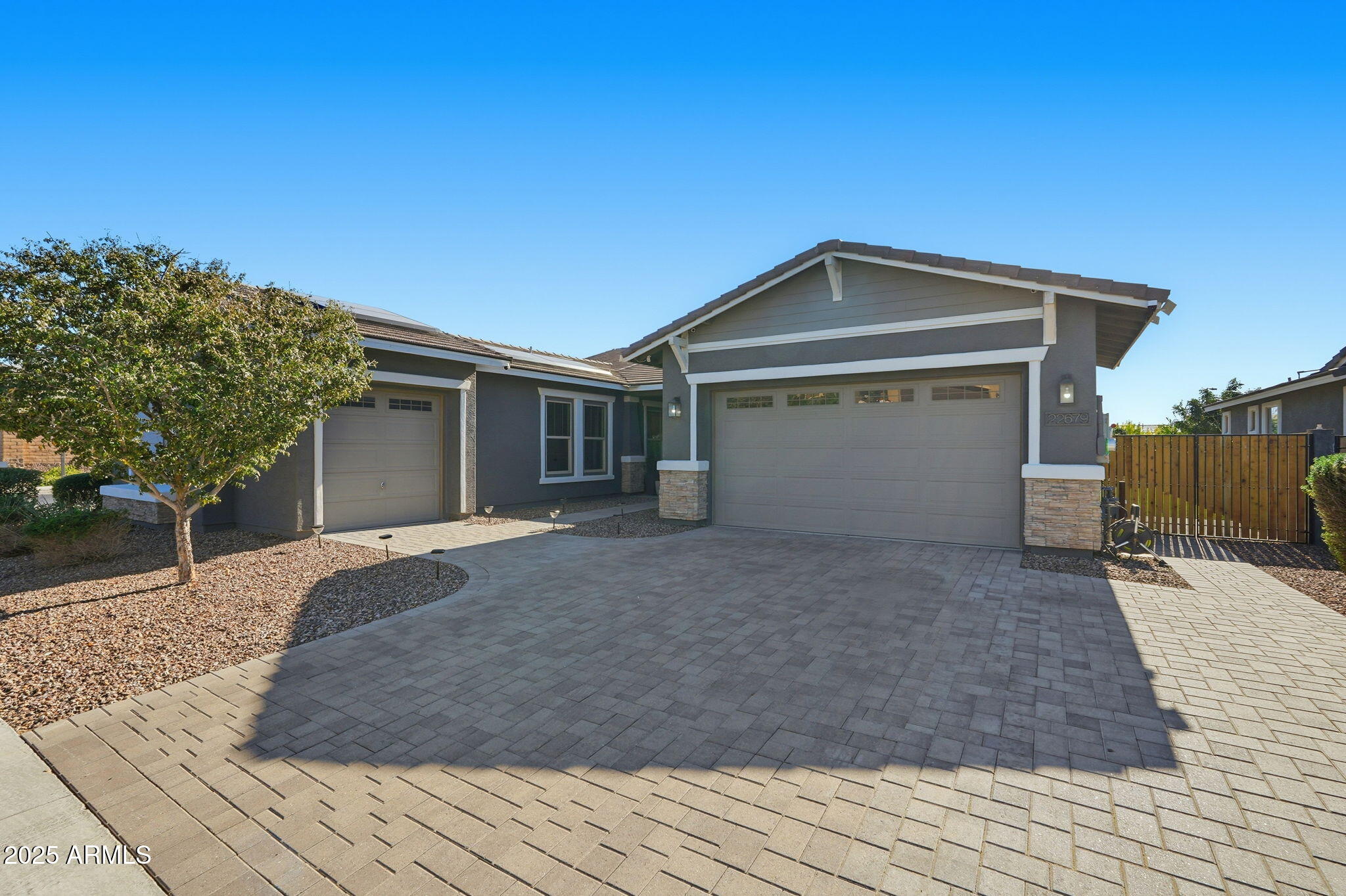 22679 East Russet Road Queen Creek, AZ 85142 - Photo 10 of 51 a front view of a house with a yard and garage