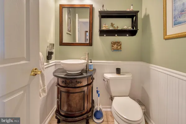 a bathroom with a double vanity sink mirror and double
