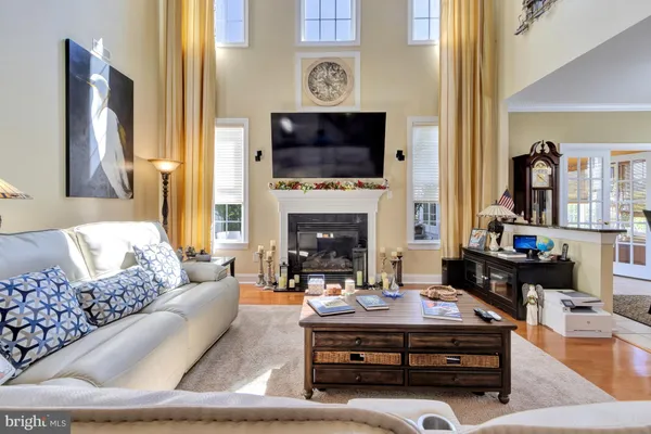 a bedroom with two beds and painting on the wall