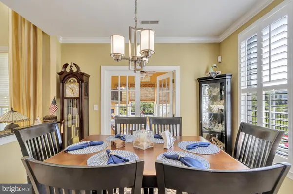 a balcony with furniture and a potted plant