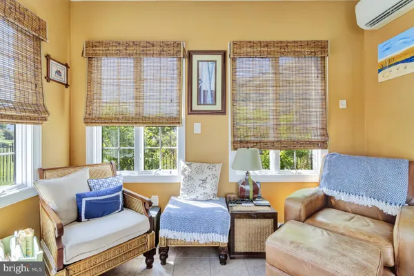 a living room with a couch and a table and chairs