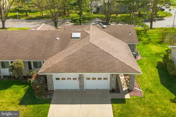 an aerial view of house with yard