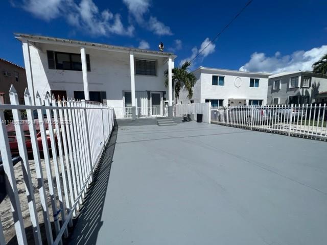 711 85th Street Miami Beach, FL 33141 - Photo 2 of 7 a view of a house with porch and wooden floor