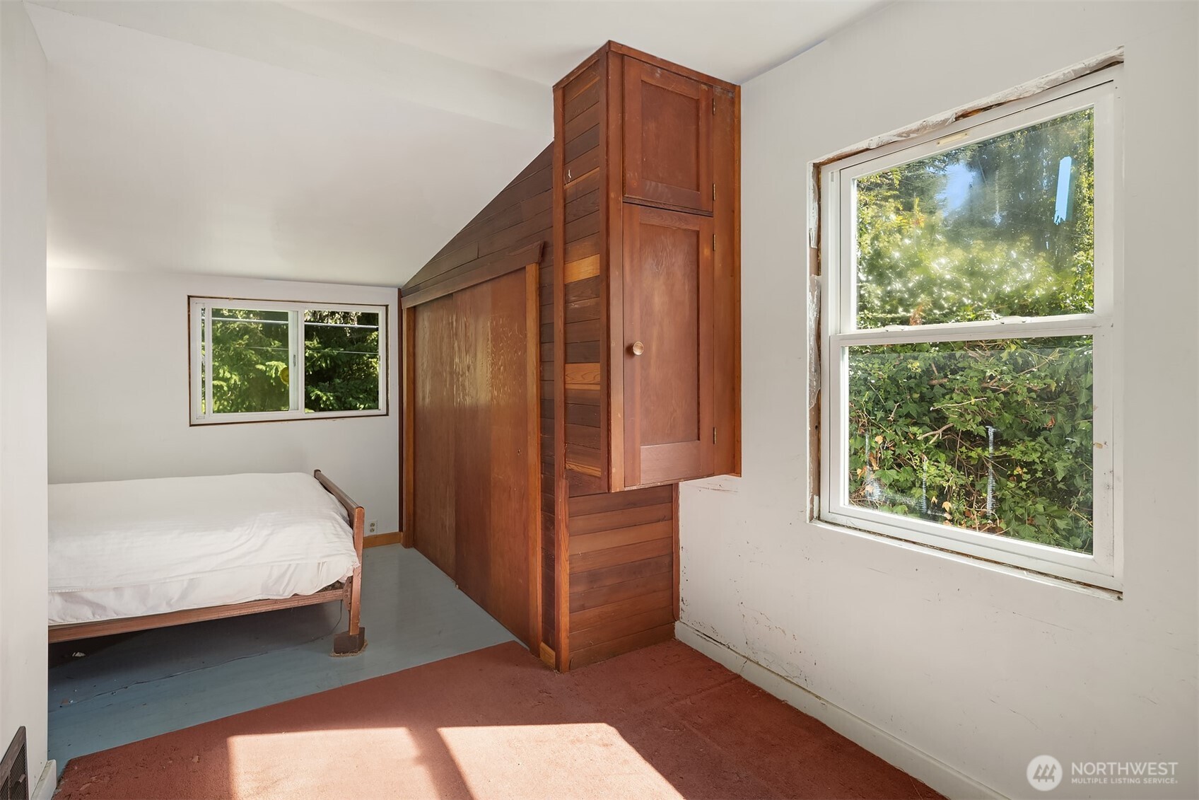 5202 35th Avenue Southwest Seattle, WA 98126 - Photo 21 of 32 a bedroom with a bed and a window