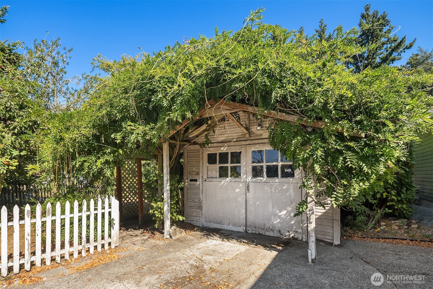 5202 35th Avenue Southwest Seattle, WA 98126 - Photo 10 of 32 a front view of a house with a tree
