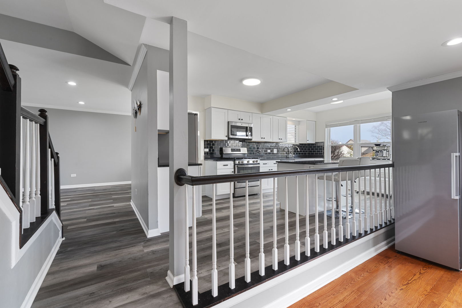 4599 Mumford Drive Hoffman Estates, IL 60192 - Photo 13 of 25 a kitchen with stainless steel appliances granite countertop a refrigerator and a sink
