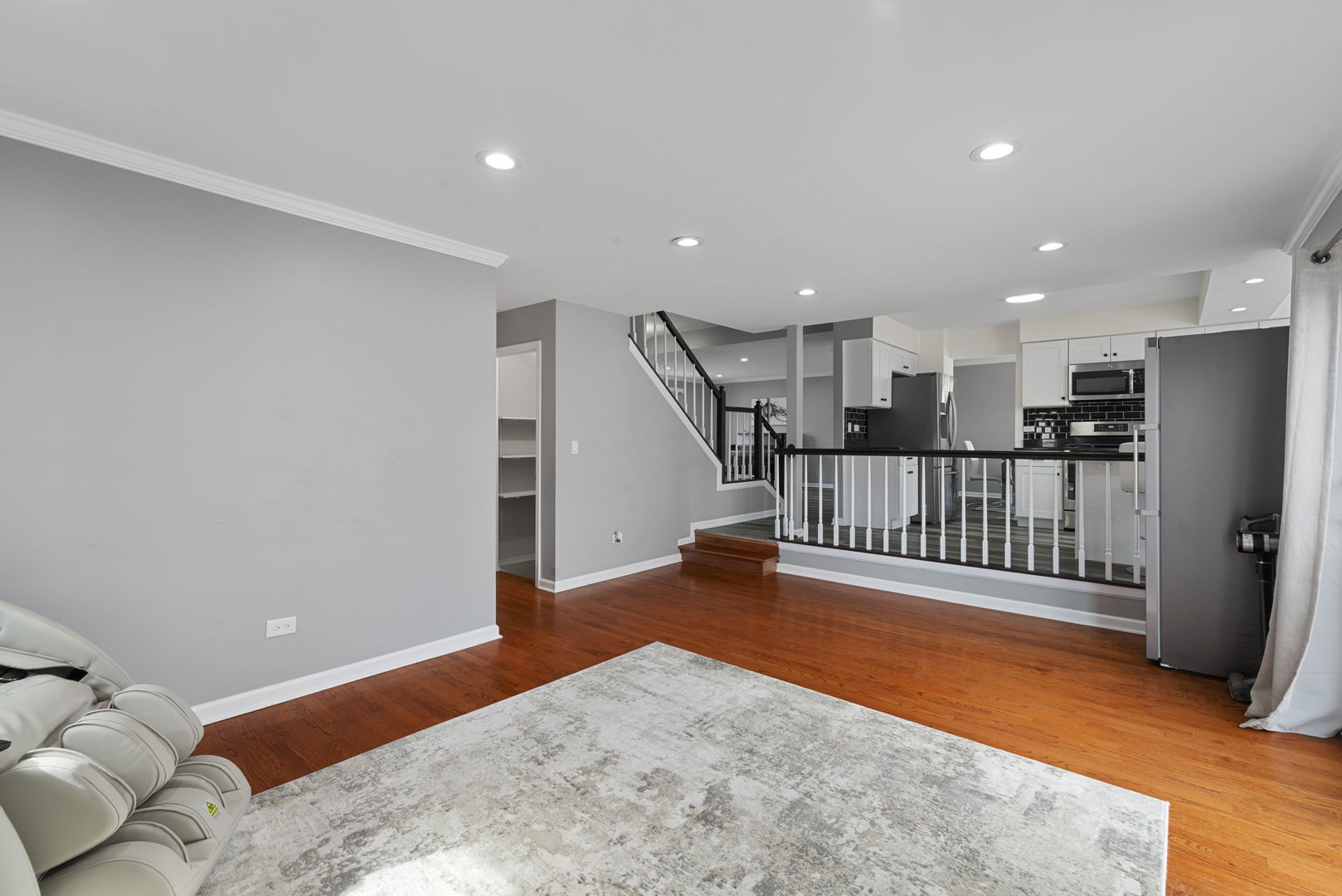 4599 Mumford Drive Hoffman Estates, IL 60192 - Photo 14 of 25 a view of a livingroom with a furniture and staircase