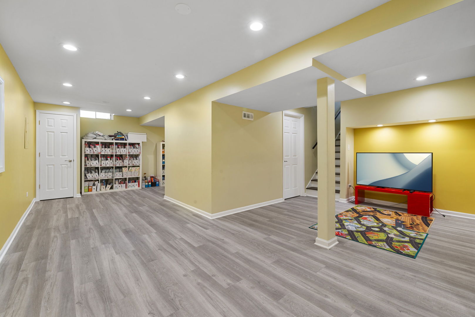 4599 Mumford Drive Hoffman Estates, IL 60192 - Photo 17 of 25 a view of an empty room with wooden floor and a ceiling fan