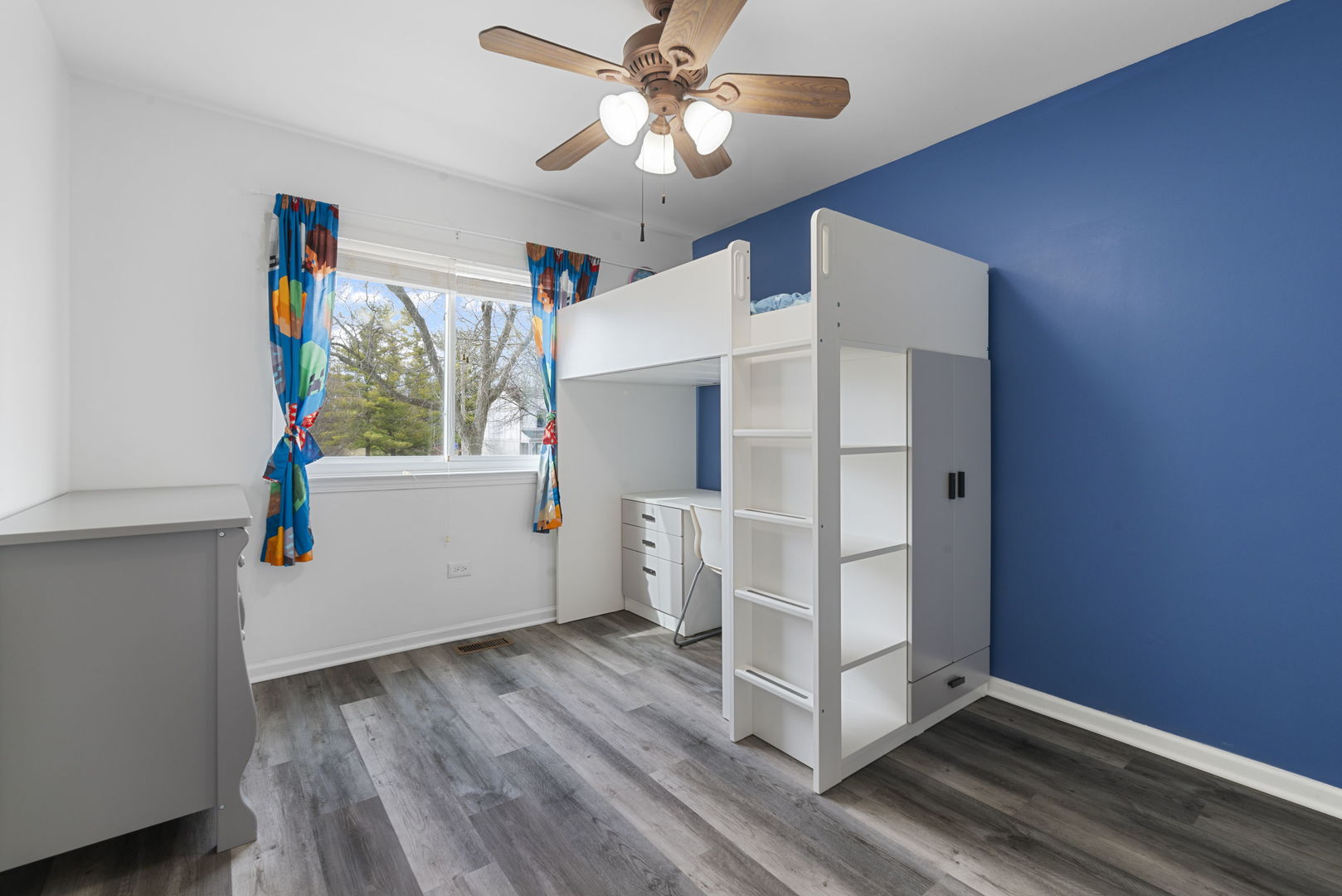 4599 Mumford Drive Hoffman Estates, IL 60192 - Photo 19 of 25 a view of an empty room with window and wooden floor