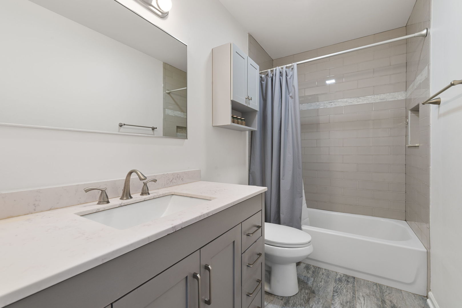 4599 Mumford Drive Hoffman Estates, IL 60192 - Photo 20 of 25 a bathroom with a sink toilet tub and shower