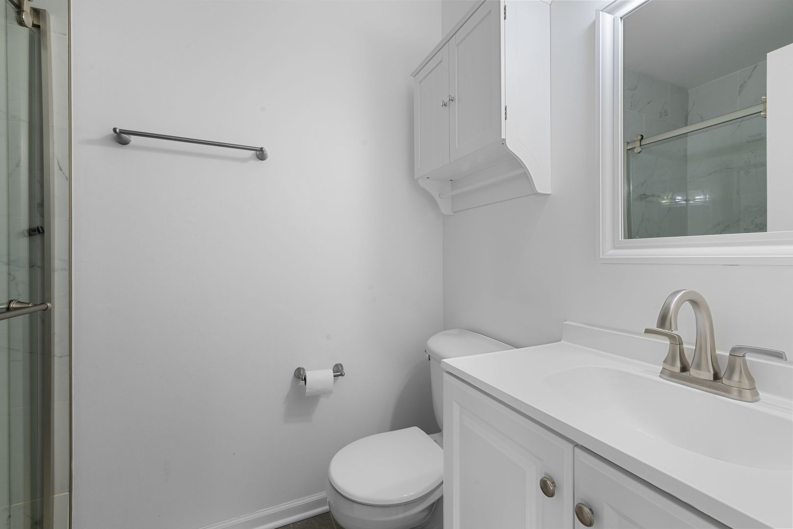 4599 Mumford Drive Hoffman Estates, IL 60192 - Photo 22 of 25 a bathroom with a sink a toilet and shower