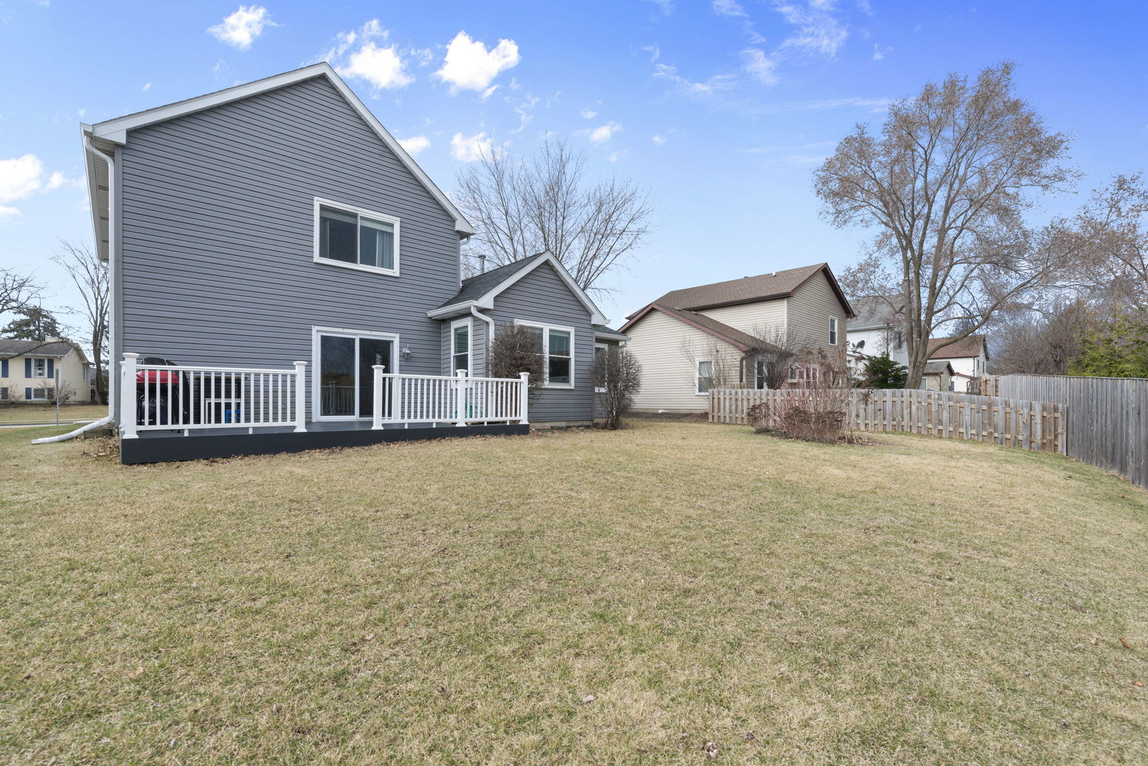 4599 Mumford Drive Hoffman Estates, IL 60192 - Photo 25 of 25 a front view of a house with a yard