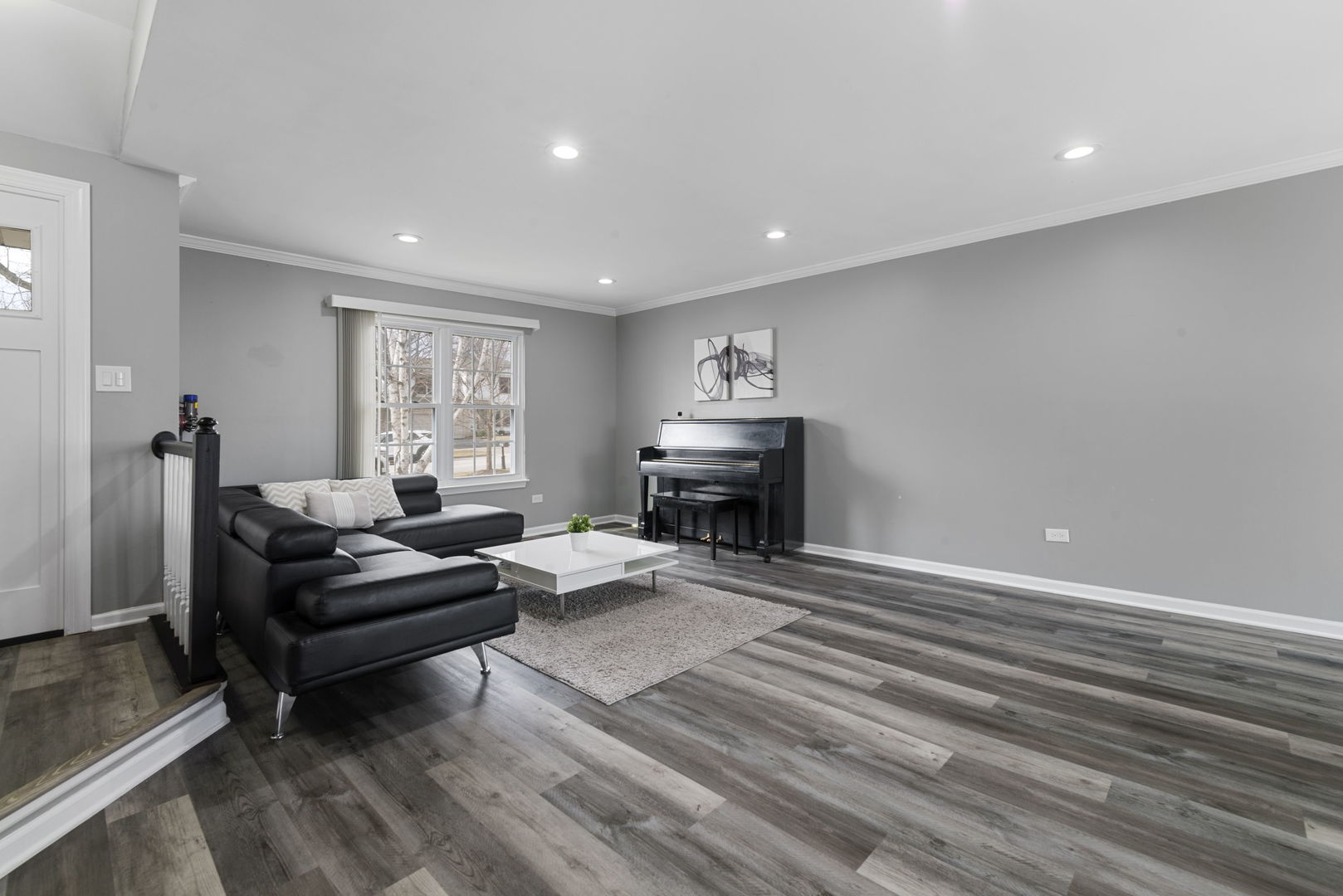 4599 Mumford Drive Hoffman Estates, IL 60192 - Photo 5 of 25 a living room with furniture and a fireplace