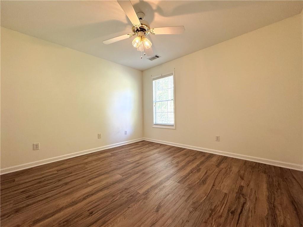2075 Pine Tree Drive Buford, GA 30518 - Photo 13 of 18 wooden floor in an empty room