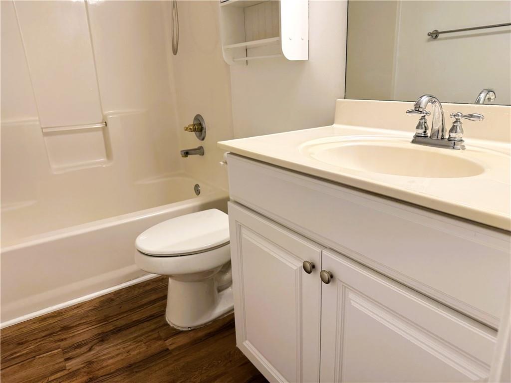 2075 Pine Tree Drive Buford, GA 30518 - Photo 15 of 18 a bathroom with a sink a toilet and shower