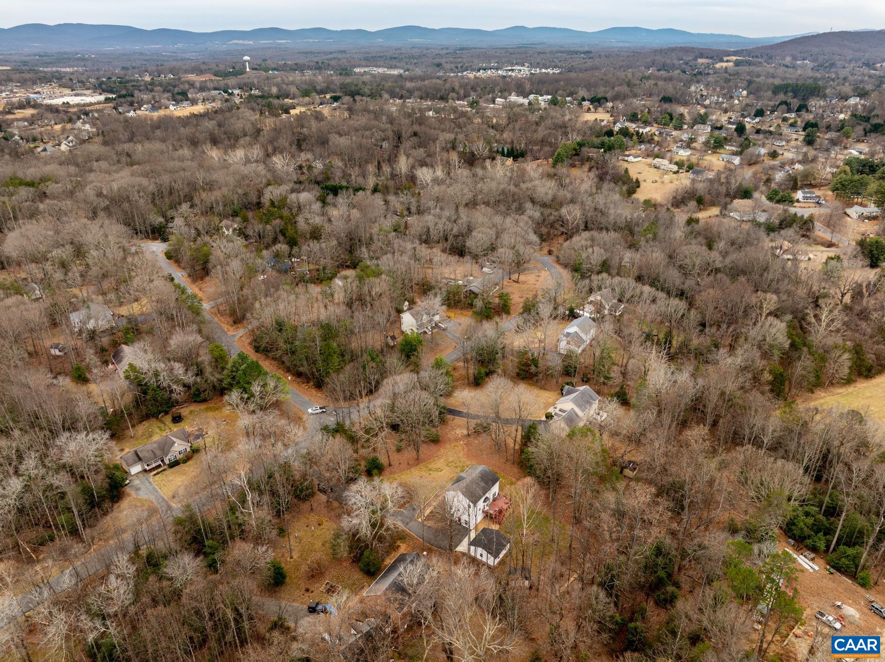 334 Carodon Drive Ruckersville, VA 22968 - Photo 13 of 54 an aerial view of town with residential houses and mountain view