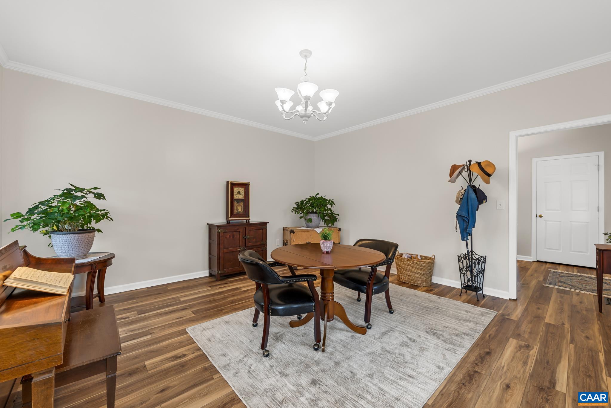 334 Carodon Drive Ruckersville, VA 22968 - Photo 15 of 54 a view of a dining room with furniture and wooden floor