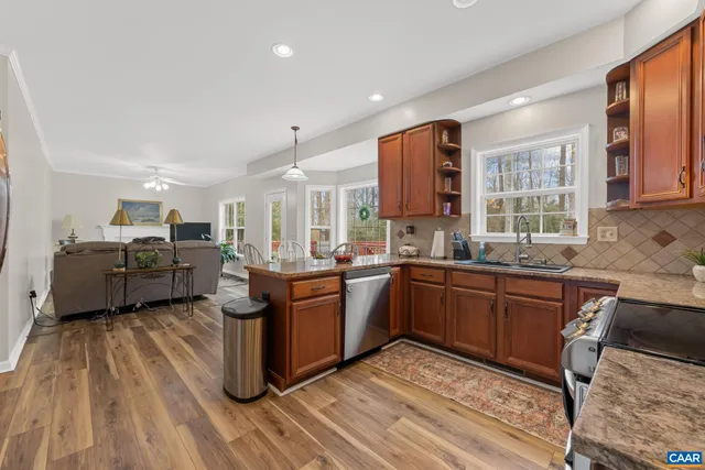 a living room with furniture a window and a fireplace