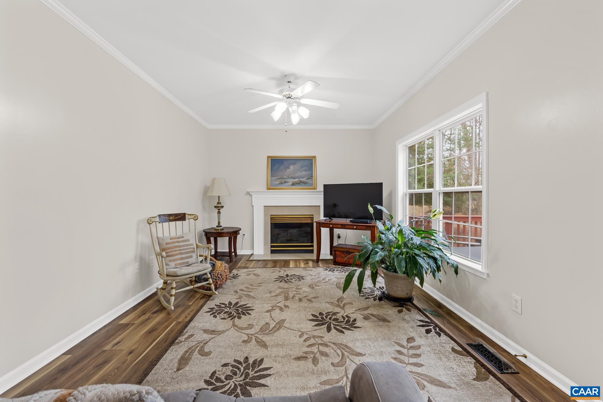 334 Carodon Drive Ruckersville, VA 22968 - Photo 23 of 54 a living room with furniture a window and a fireplace
