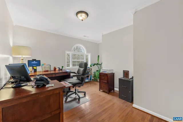 a bathroom with double vanity sinks a toilet a mirror and a window