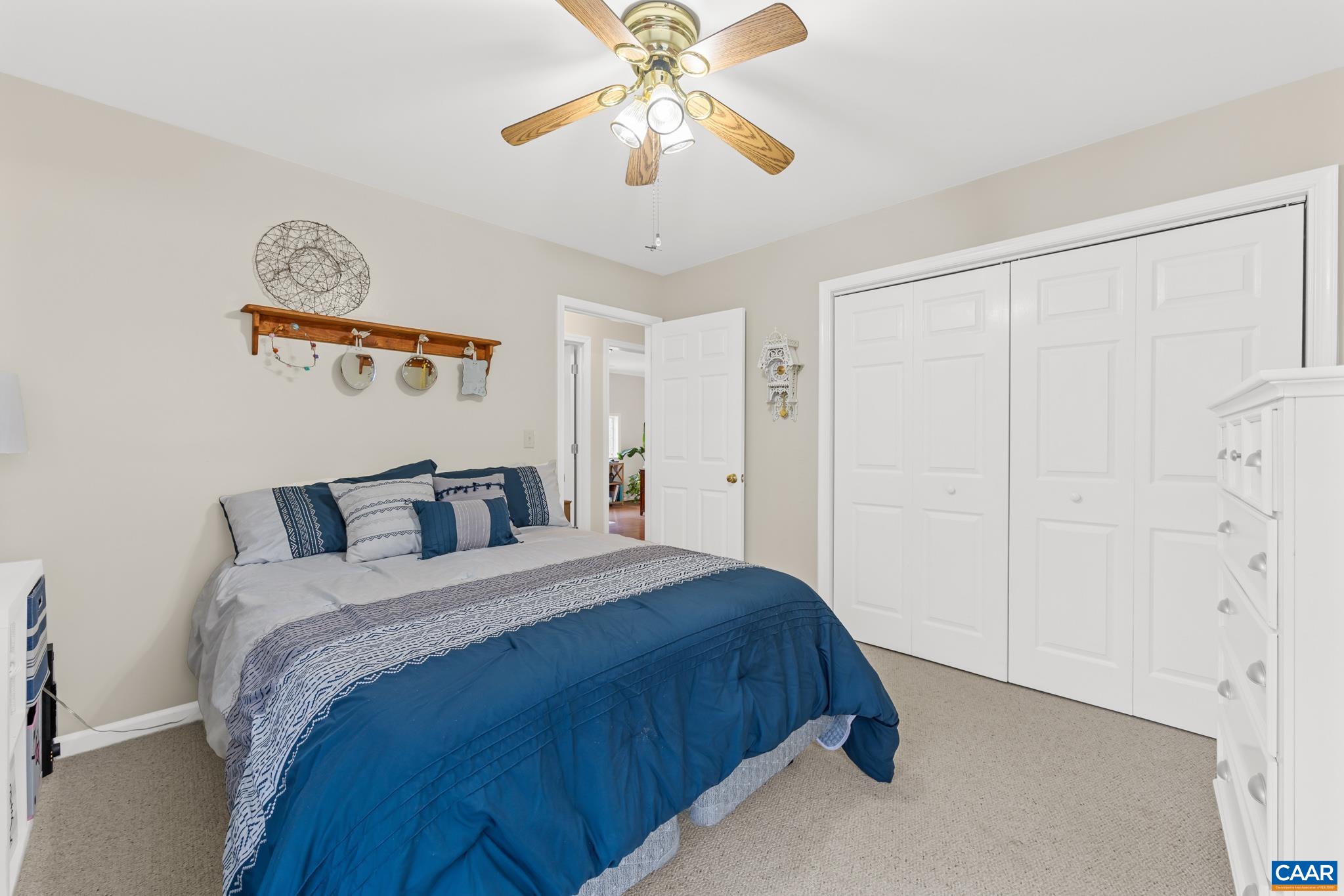 334 Carodon Drive Ruckersville, VA 22968 - Photo 37 of 54 a bedroom with a bed and a chandelier