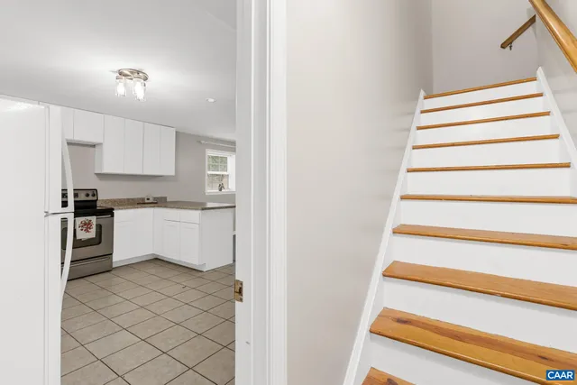 a view of a kitchen with a sink and cabinets