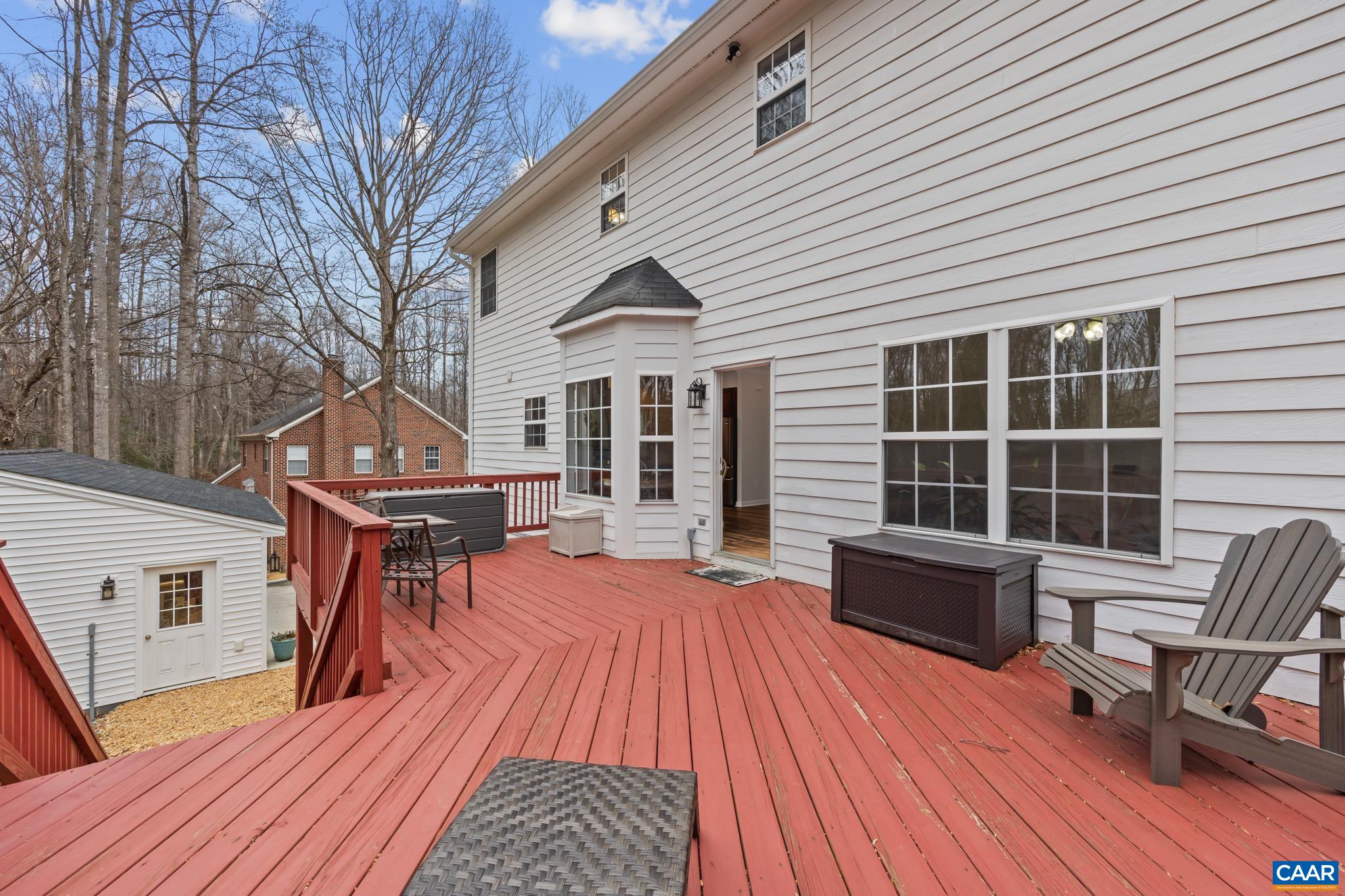 334 Carodon Drive Ruckersville, VA 22968 - Photo 9 of 54 a balcony with furniture and wooden floor