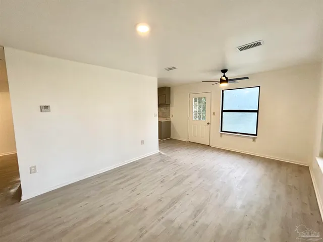 a view of a storage & utility room with a window