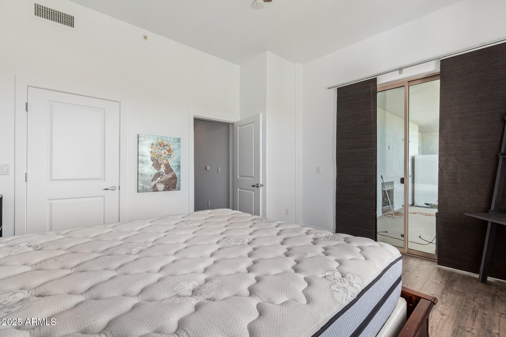 945 East Playa Del Norte Drive, Unit 3004 Tempe, AZ 85288 - Photo 18 of 41 a bedroom with a bed and a flat screen tv