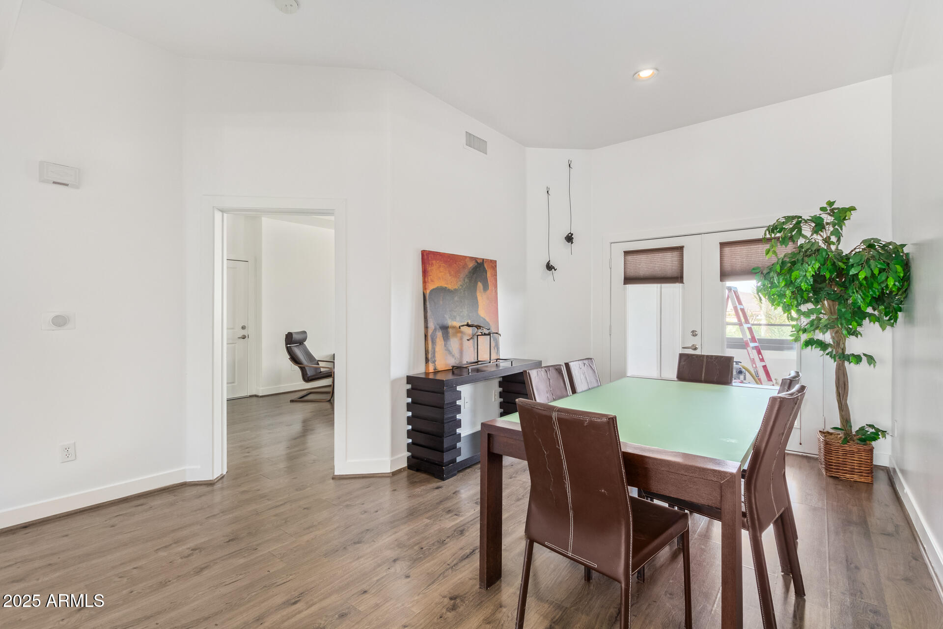 945 East Playa Del Norte Drive, Unit 3004 Tempe, AZ 85288 - Photo 5 of 41 a view of a dining room with furniture and wooden floor