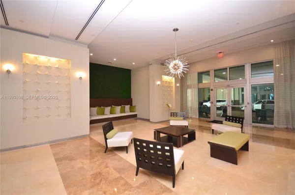 a living room with patio furniture and a flat screen tv