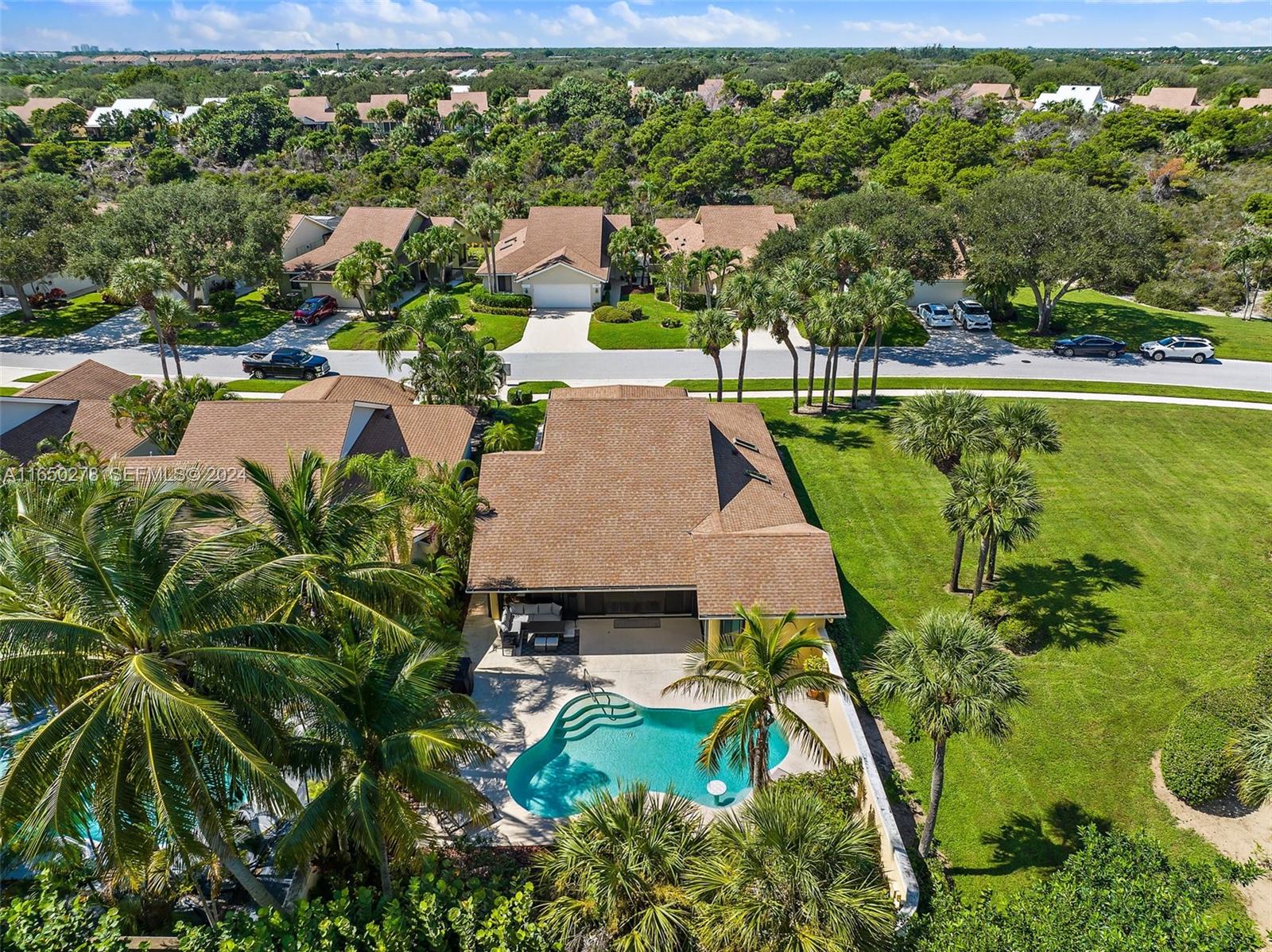 101 Sand Pine Drive, Unit 101 Jupiter, FL 33477 - Photo 45 of 47 an aerial view of a house with a yard basket ball court and outdoor seating