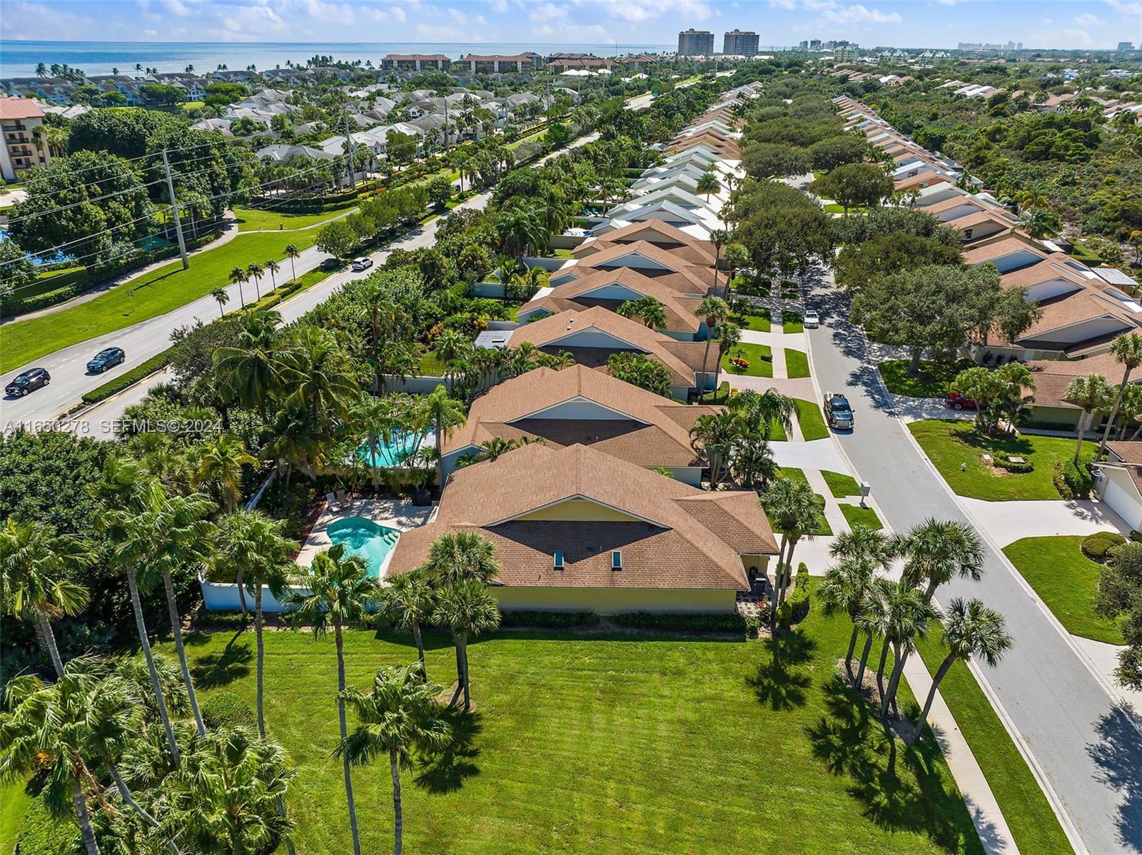 101 Sand Pine Drive, Unit 101 Jupiter, FL 33477 - Photo 5 of 47 an aerial view of residential houses with outdoor space and street view