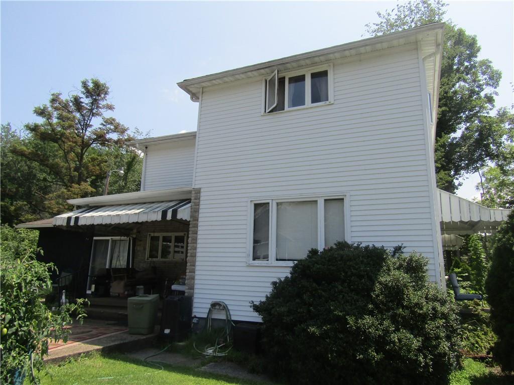 174 Juniata Road Dunbar, PA 15431 - Photo 2 of 12 a house view with a garden space